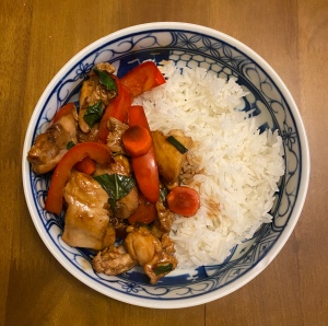 A bowl of Basil Chicken with rice. 