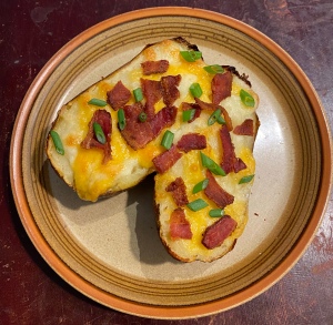 Loaded baked potatoes on a plate