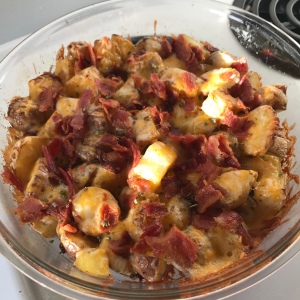Roasted potatoes topped with cheese and bacon