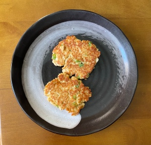 Two salmon cakes on a plate